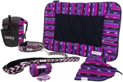 Assortment of craftsman built dog gear in pink, purple, and black