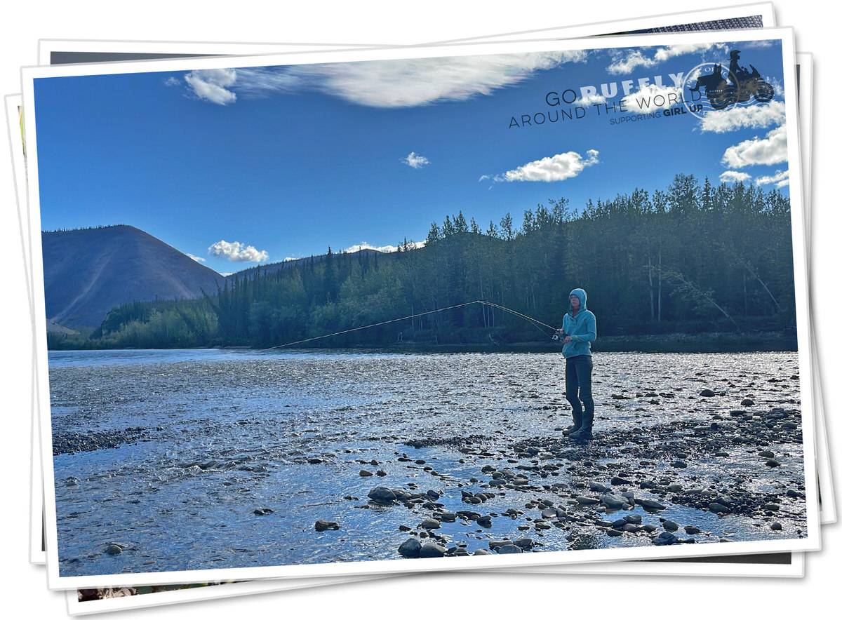 Postcard of a woman fishing on a river in the Yukon Territory