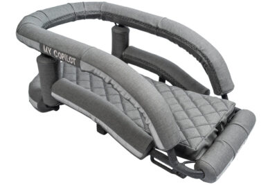 Craftsman built and upholstered motorcycle dog carrier in dark grey vinyl upholstery with embroidered branding: "MY COPILOT"