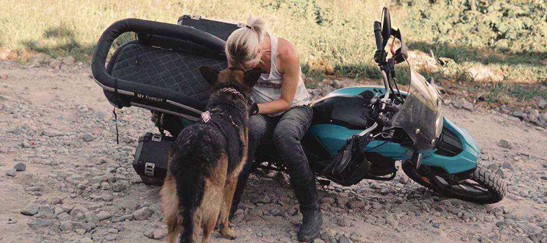 German shepherd shows affection to young woman after off-road motorcycle crash