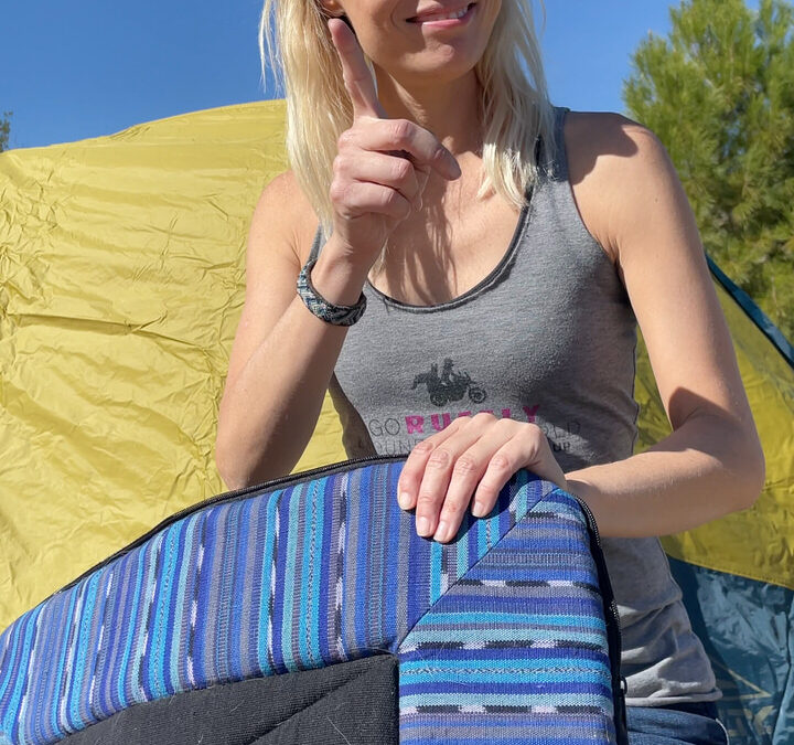 Woman raises finger and shows craftsman dog bedroll